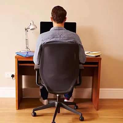 Picture of a web designer sitting at a desk